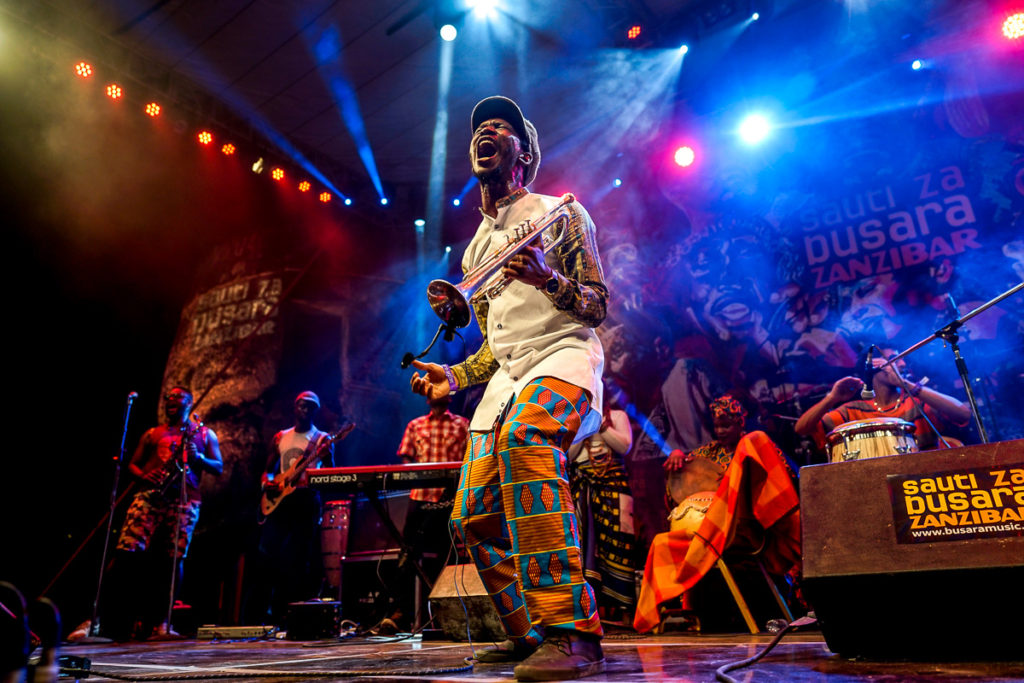 Trumpeter Mandla Mlangeni screams on stage at Sauti za Busara 2019. Photo: Andy Morgan