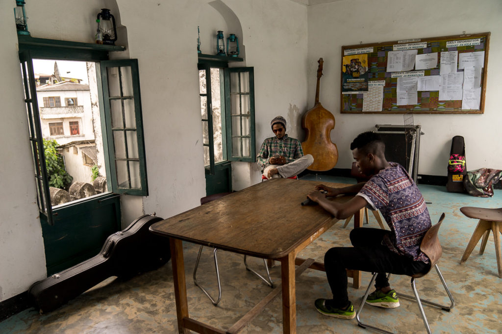 Students relaxing at the Dhow Music Academy, Stone Town, Zanzibar. February 2019