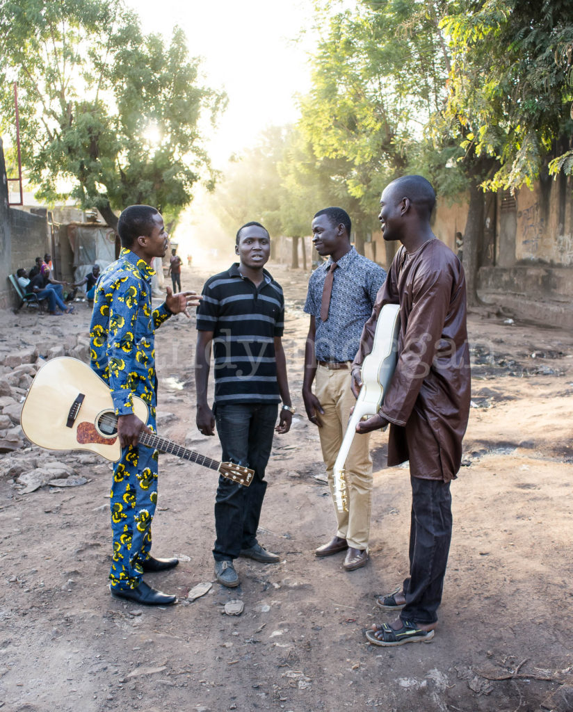 Ali and Songhoy Blues in the streets of Bamako, Mali, 2014 (L-R Oumar, Ali, Nat, Garba). Photo: Andy Morgan.