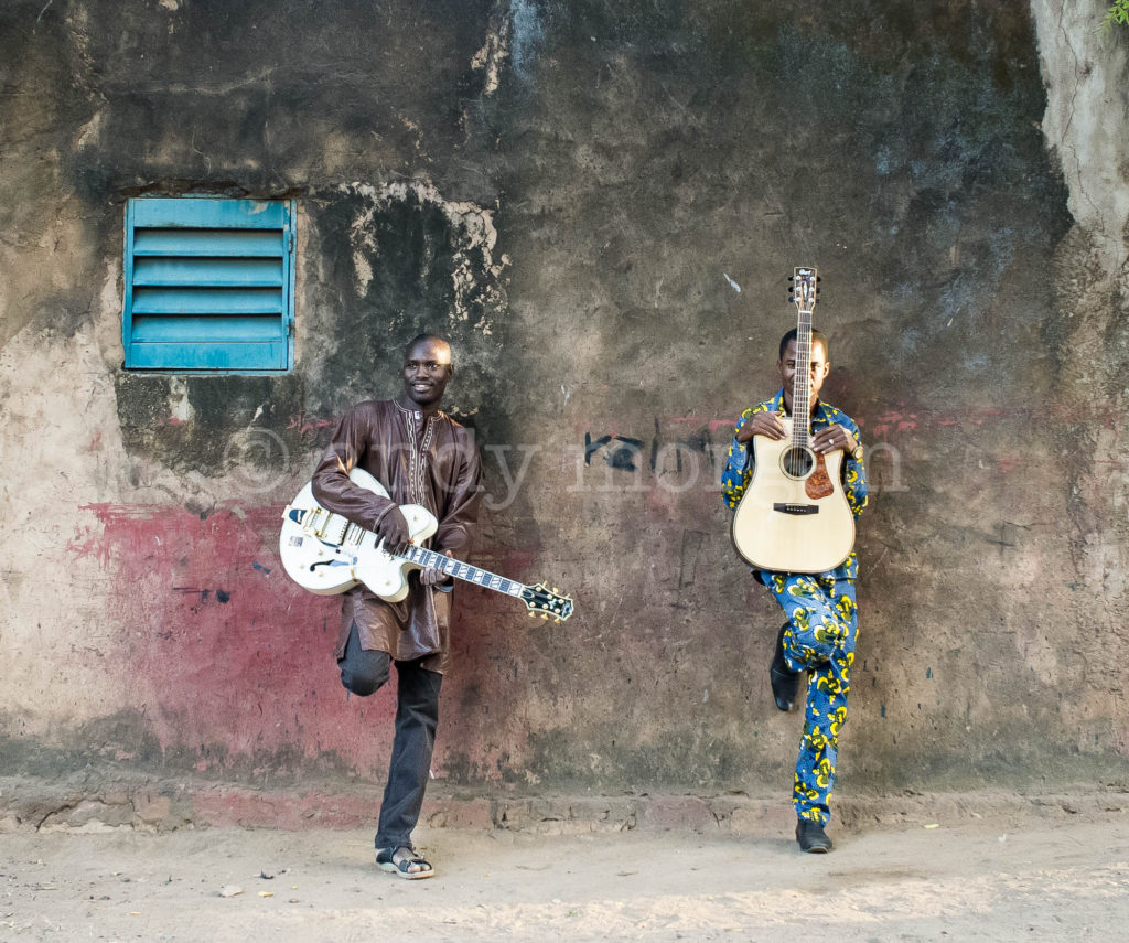Garba and Oumar from Songhoy Blues propping up the wall. Bamako, Mali - 2014. Photo: Andy Morgan