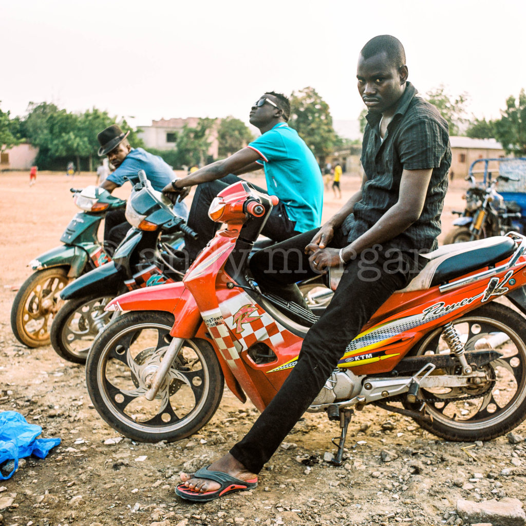 Garba, Nat and Oumar from Songhoy Blues on their 'djakarta' motorbikes, Bamako, Mali - 2014. Photo: Andy Morgan